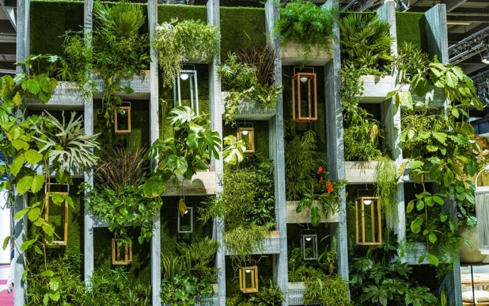 Plants on large concrete shelf. Plant wall.